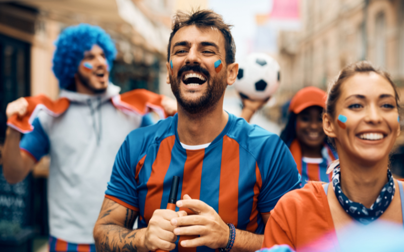 Football supporters celebrating before a women's football match